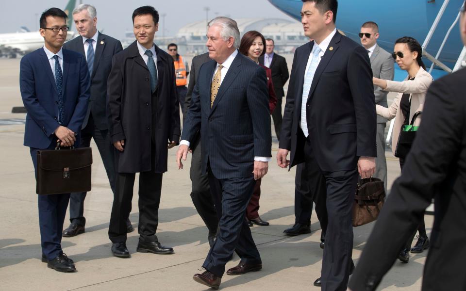 Rex Tillerson arrives in Beijing - Credit: AP
