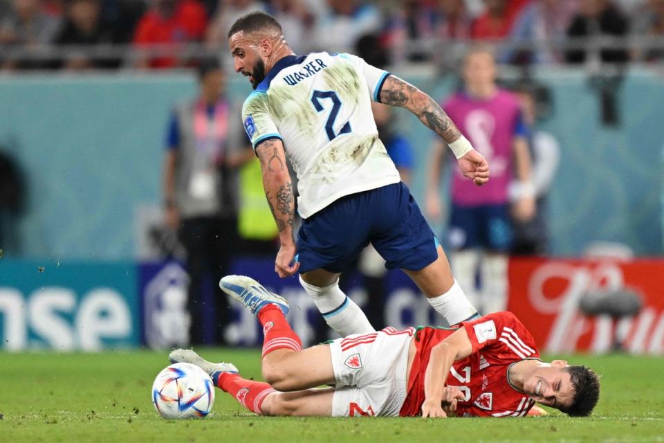 Daniel James falls as he fights with the ball with Kyle Walker (AFP/Getty)