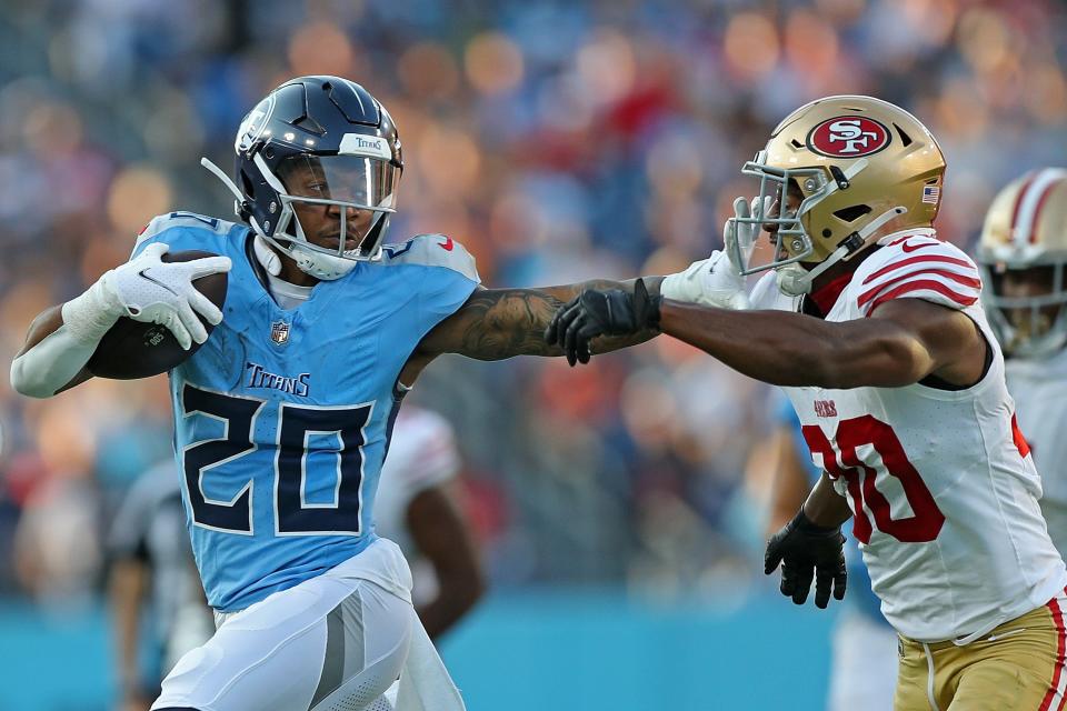 NASHVILLE, TENNESSEE - AUGUST 10: Tony Pollard #20 of the Tennessee Titans stiff arms George Odum #30 of the San Francisco 49ers during the first half at Nissan Stadium on August 10, 2024 in Nashville, Tennessee. (Photo by Justin Ford/Getty Images) ORG XMIT: 776171305 ORIG FILE ID: 2166249045