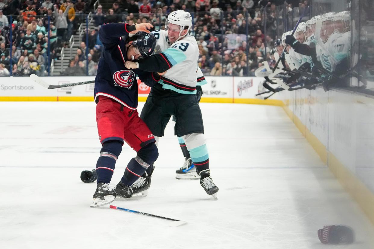 Jan 13, 2024; Columbus, Ohio, USA; Seattle Kraken defenseman Vince Dunn (29) fights Columbus Blue Jackets center Cole Sillinger (4) during the second period of the NHL hockey game at Nationwide Arena.
