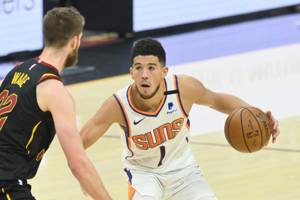 Devin Booker scored 31 points to lead the Suns to a 134-118 overtime win over the Cavaliers.
