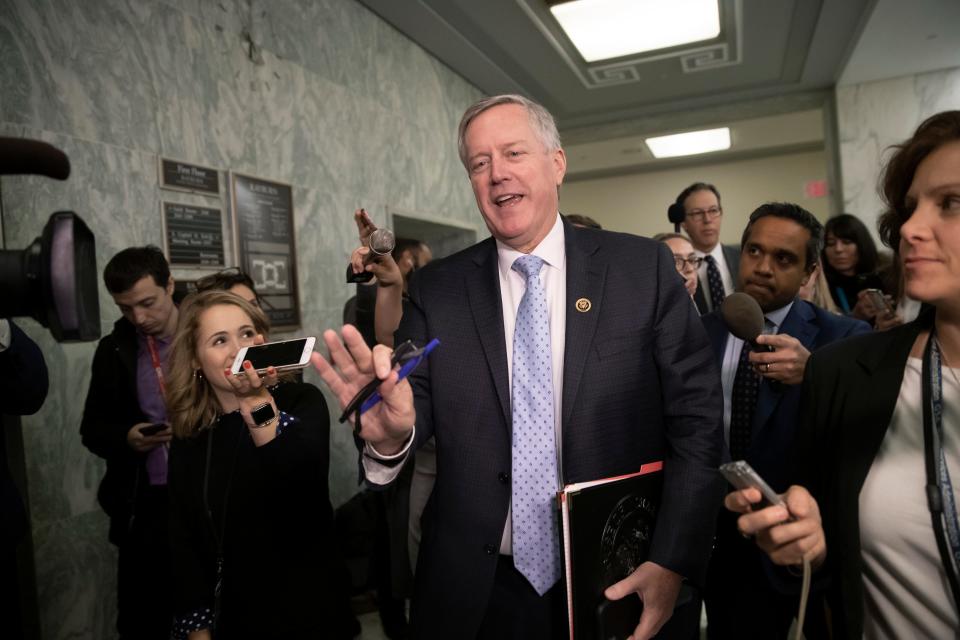 Rep. Mark Meadows, R-N.C., chairman of the conservative House Freedom Caucus, is met by reporters on Capitol Hill in Washington, D.C., Dec. 7, 2018.