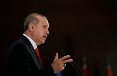 FILE PHOTO: Turkish President Tayyip Erdogan speaks during an iftar dinner in Ankara, Turkey May 21, 2018. Murat Kula/Presidential Palace/Handout via REUTERS