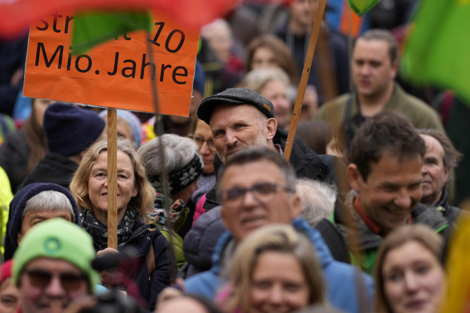 People attend a rally marking the nuclear shutdown in Germany in Munich, Germany, Saturday, April 15, 2023. Germany is shutting down the last three nuclear power plants today as a part of an energy transition agreed by successive governments. (AP Photo/Matthias Schrader)