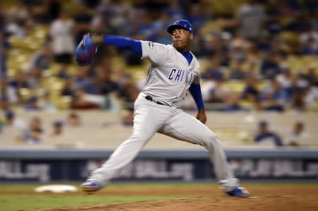 Oct 20, 2016; Los Angeles, CA, USA; Chicago Cubs relief pitcher Aroldis Chapman (54) delivers a pitch in the ninth inning against the Los Angeles Dodgers in game five of the 2016 NLCS playoff baseball series against the Los Angeles Dodgers at Dodger Stadium. Mandatory Credit: Kelvin Kuo-USA TODAY Sports