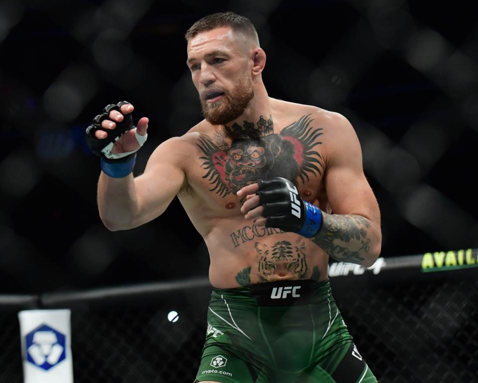 Conor McGregor fights Dustin Poirier during UFC 264 at T-Mobile Arena in 2021.
