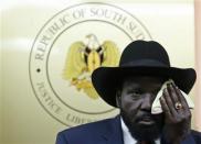 South Sudan's President Salva Kiir wipes his face during a news conference in Juba December 18, 2013. REUTERS/Goran Tomasevic