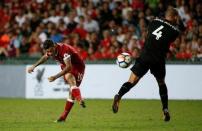 Soccer Football - Leicester City v Liverpool - Pre Season Friendly - The Premier League Asia Trophy - Final - June 22, 2017 Liverpool's Philippe Coutinho shoots at goal as Leicester City's Danny Drinkwater attempts to block REUTERS/BOBBY YIP