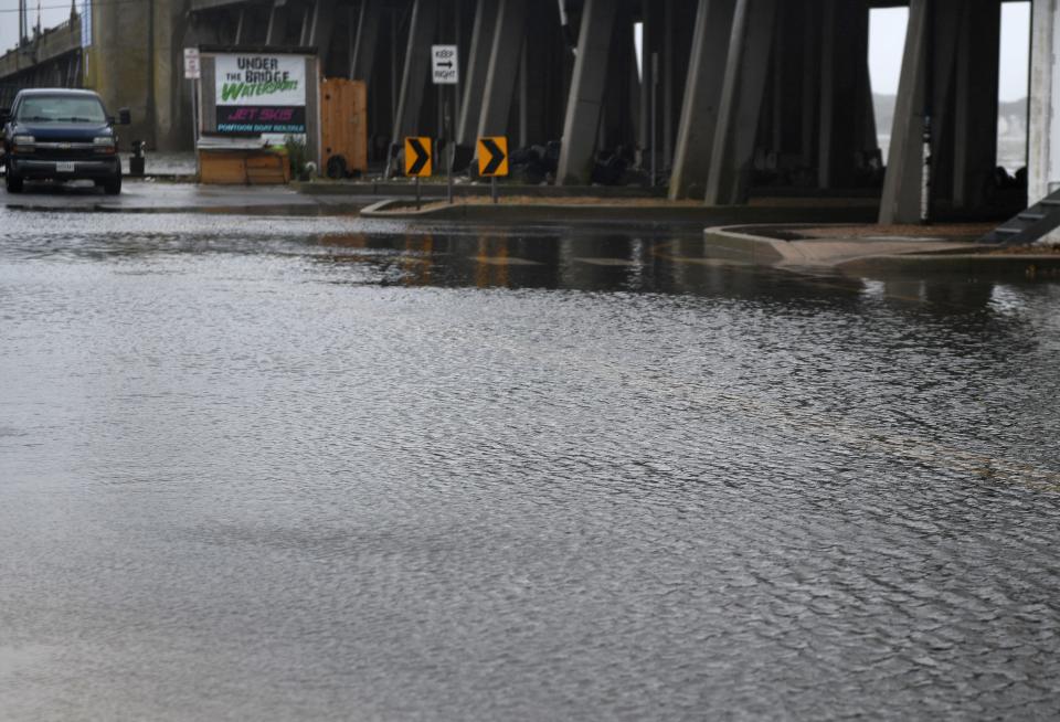 Water covers the road on Caroline Street Monday, Oct. 3, 2022, in Ocean City, Maryland.