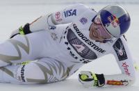 FILE - In hits Dec. 9, 2017, file photo, United States' Lindsey Vonn grimaces in pain after getting to the finish area of an women's World Cup super-G ski race in St. Moritz, Switzerland. Vonn announced Friday, Feb. 1, 2019, that she will retire from ski racing after this month's world championships in Sweden. (AP Photo/Giovanni Auletta, File)