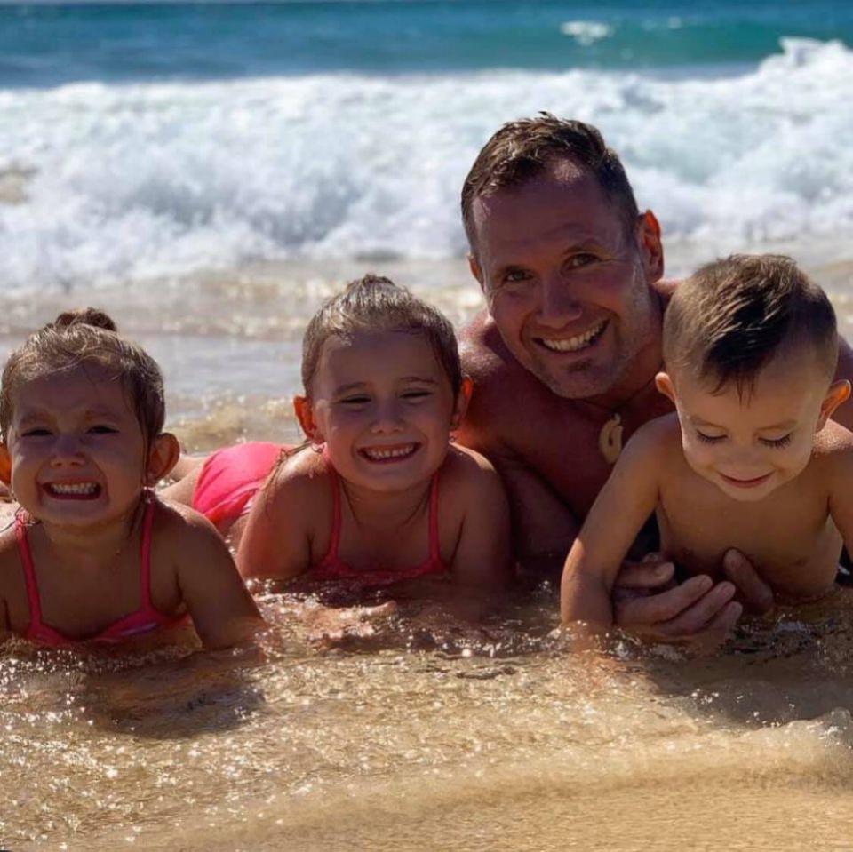 Rowan Baxter pictured with his kids Laianah, Aaliyah and Trey.