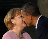 <p>President Barack Obama gives German Chancellor Angela Merkel a kiss on the cheek on arrival for the G8 Summit Friday, May 18, 2012 at Camp David, Md. (AP Photo/Charles Dharapak) </p>
