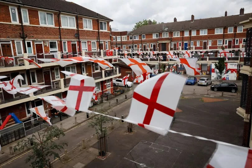 A general view of the Kirby estate in east London covered in banners of England flags