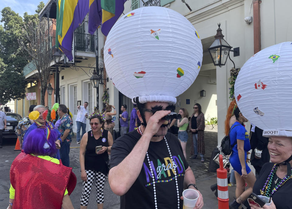 Jerome FitzGibbons of New Orleans walks the streets of the French Quarter on Mardi Gras, costumed as a Chinese spy balloon on Tuesday, Feb. 21, 2023. (AP Photo/Kevin McGill)