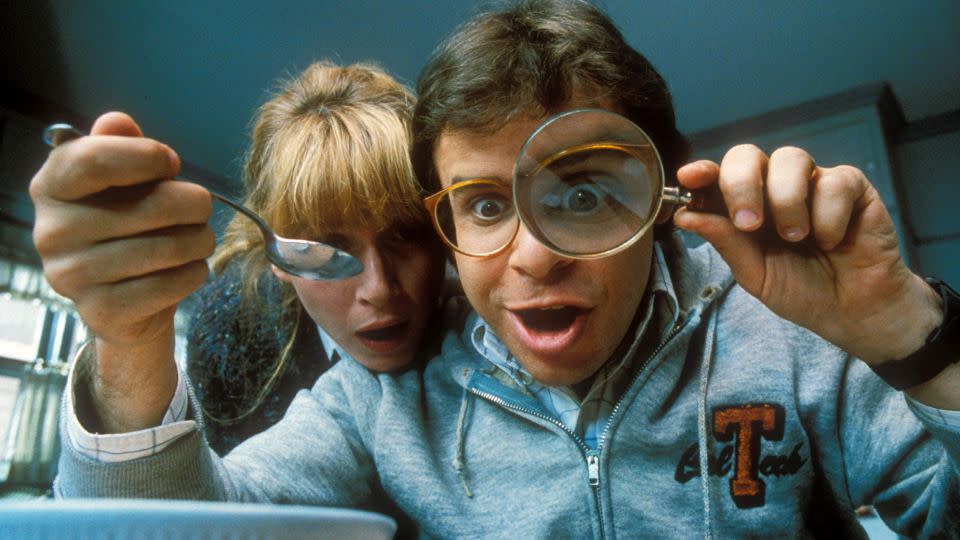 Wayne Szalinski (played by Rick Moranis) and his wife, Diane (Marcia Strassman), notice their shrunken son, Nick, in Wayne’s bowl of cereal in the 1989 comedy film "Honey, I Shrunk the Kids." - Disney/Kobal/Shutterstock