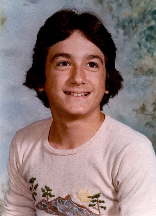 Dion Labriola sits for an eighth grade portrait in the 1970s at Roswell Kent Junior High School in Akron.