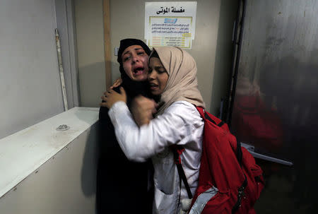 The aunt of 14-year-old Palestinian boy Yasser Abu Al-Naja, who was killed by Israeli forces during a protest at the Israel-Gaza border, reacts at a hospital morgue in the southern Gaza Strip June 29, 2018. REUTERS/Ibraheem Abu Mustafa