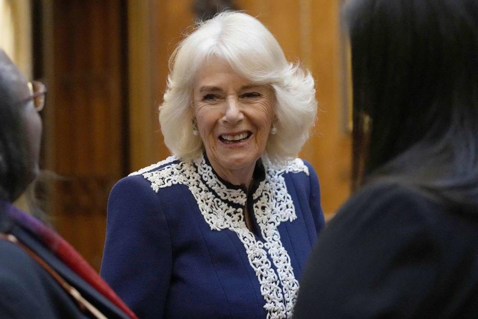 <p>KIRSTY WIGGLESWORTH/POOL/AFP via Getty Images</p> Queen Camilla at the Windsor Castle reception for the new Miniature Library collection on Jan. 30.