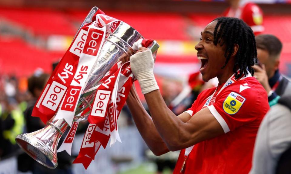 Nottingham Forest's Djed Spence lifts the trophy following promotion to the Premier League after the Sky Bet Championship play-off final