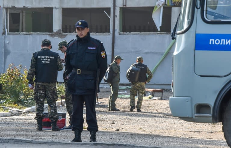 Russian investigators examined the college in Kerch, Crimea where a student opened fire