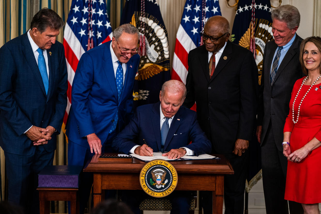 WASHINGTON, DC  August 16, 2022:

US President Joe Biden signs into law H.R. 5376, the Inflation Reduction Act of 2022 (climate change and health care bill) in the State Dining Room of the White House on Tuesday August 16, 2022. From left, Sen. Joe Manchin (D-W.VA), Senate Majority Leader Chuck Schumer (D-NY), House Majority Whip Rep. James Clyburn (D-SC), Rep. Frank Pallone (D-NJ), and Rep. Kathy Castor (D-FL).
(Photo by Demetrius Freeman/The Washington Post via Getty Images)