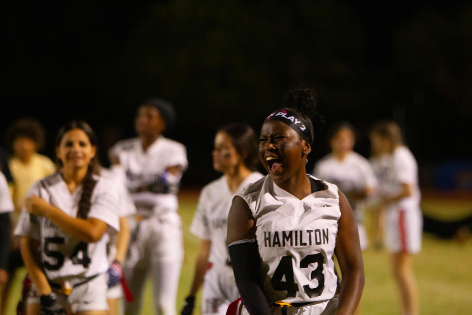 Hamilton's Naomi Ndayizeye cheers on her teammates during a flag football game at Chandler High School on Oct. 17, 2023.