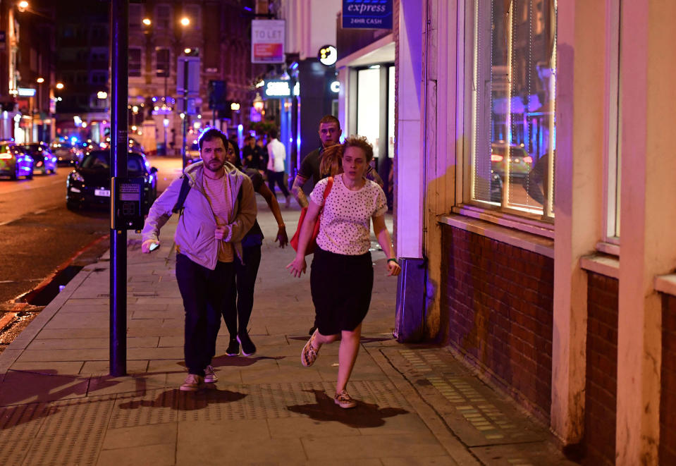 <p>People run down Borough High Street as police are dealing with a “major incident” at London Bridge in London, Saturday, June 3, 2017. London incident. (Dominic Lipinski/PA via AP) </p>