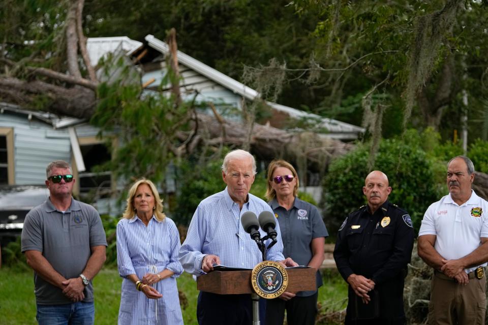President Joe Biden speaks in front of a home damaged by fallen trees and debris following a survey of damage caused by Hurricane Idalia, Saturday, Sept. 2, 2023, in Live Oak, Fla.
