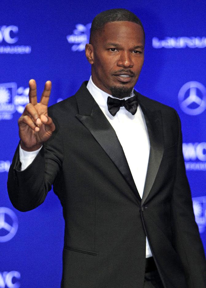 FILE - This March 26, 2014 file photo, U.S. actor Jamie Foxx poses for photos upon arriving at the Laureus World Sports Awards in Kuala Lumpur, Malaysia. CBS announced Thursday, April 10, 2014, that Stephen Colbert will succeed David Letterman as "Late Show" host, but there were other performers who could have been contenders, including Ellen DeGeneres, Foxx, Tina Fey, Amy Poehler, Louis C.K., Neil and Patrick Harris. (AP Photo/Lai Seng Sin, file)