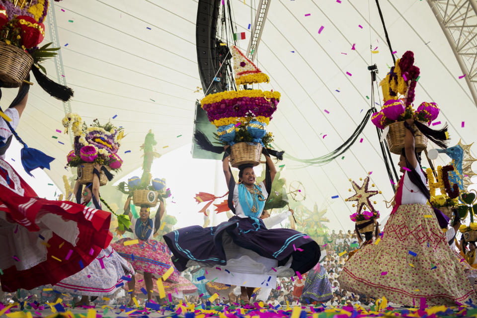 Dancers perform on the first day of the Guelaguetza in Oaxaca, Mexico, Monday, July 17, 2023. During the government-sponsored event, 16 Indigenous ethnic groups and the Afro-Mexican community promote their traditions through public dances, parades and craft sales. (AP Photo/Maria Alferez)