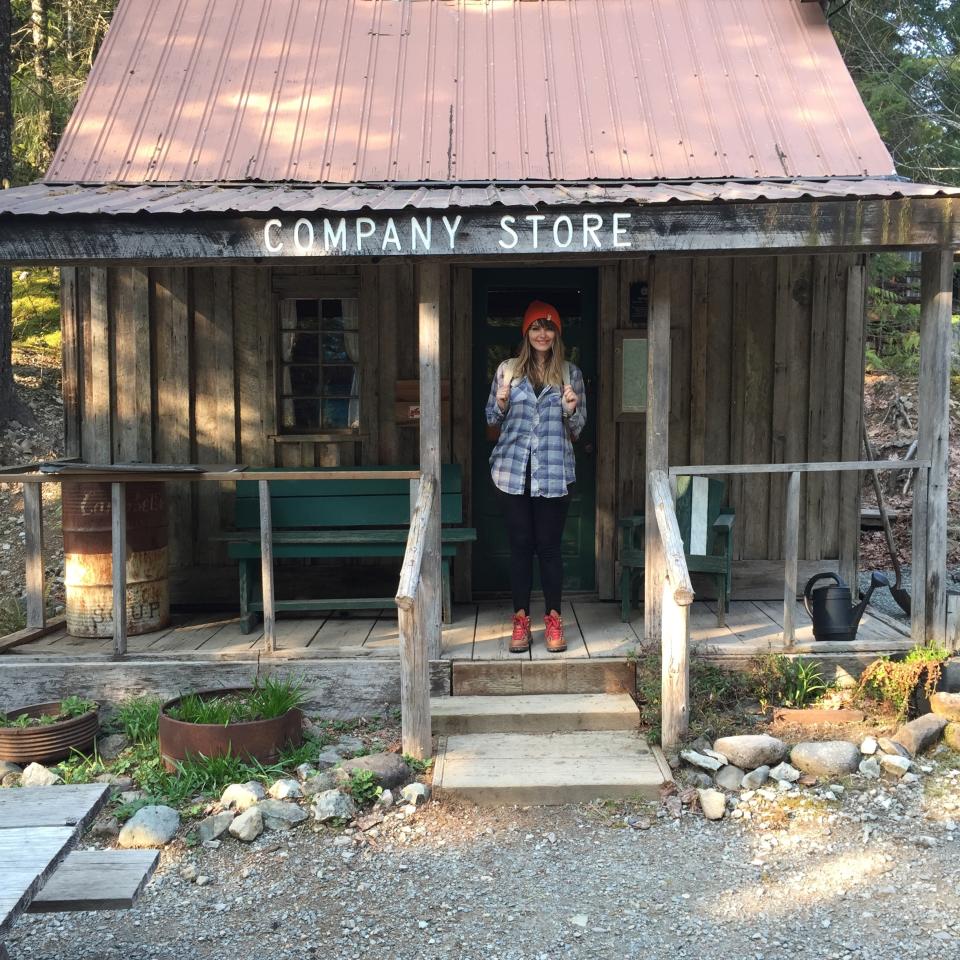 In this photo provided by Ashod Simonian, Eden Dawn poses at Jawbone Flats in the Opal Creek Wilderness in Oregon. Oregonians are grieving the loss of some of their most treasured natural places after wildfires wiped out campgrounds, hot springs and wooded retreats that have been touchstones for generations in a state known for its unspoiled beauty. "Nature IS the icon in Oregon. We have this collective grief and some of that is (from) growing up here," said Dawn, a fashion editor at Portland Monthly magazine who wrote an essay about the wildfires. (Ashod Simonian via AP)