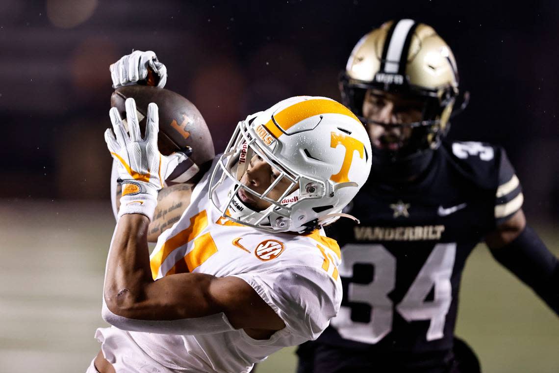 Tennessee wide receiver Jalin Hyatt (11) catches a pass in front of Vanderbilt defensive back Ja’Dais Richard (34) during the first half of an NCAA college football game Saturday, Nov. 26, 2022, in Nashville, Tenn.