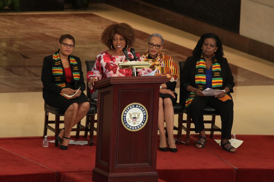 Actress Alfre Woodard speaks as Rep. Karen Bass, D-Calif., chairwoman of the Congressional Black Caucus, anthropologist Johnnetta Cole and historian Annette Gordon-Reed listen during a commemoration event at the Emancipation Hall of the U.S. Capitol September 10, 2019 in Washington, DC.