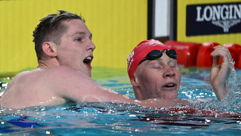 Scotland’s Duncan Scott (L) celebrates winning and taking the gold medal, with second placed England’s Tom Dean, in the men’s 200m freestyle swimming final at the Sandwell Aquatics Centre (AFP via Getty Images)