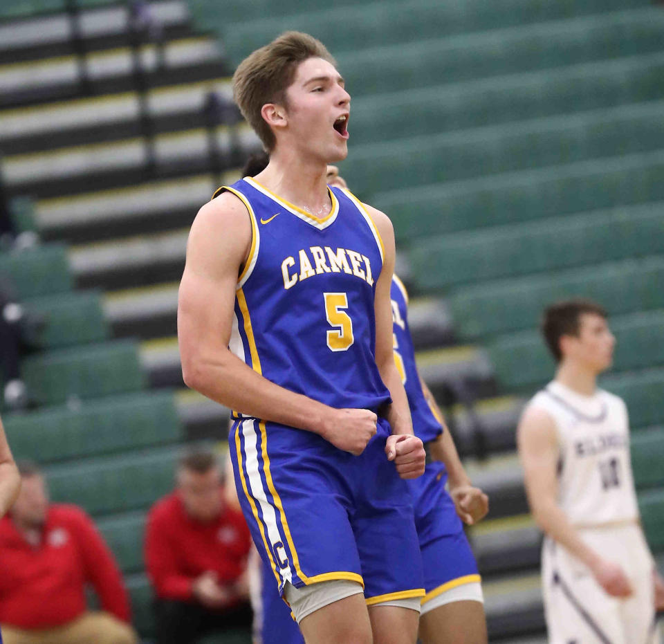 Carmel's Pete Suder reacts during their win over Elder at the Ohio Valley Hoops Classic, Saturday, Nov. 26, 2021.