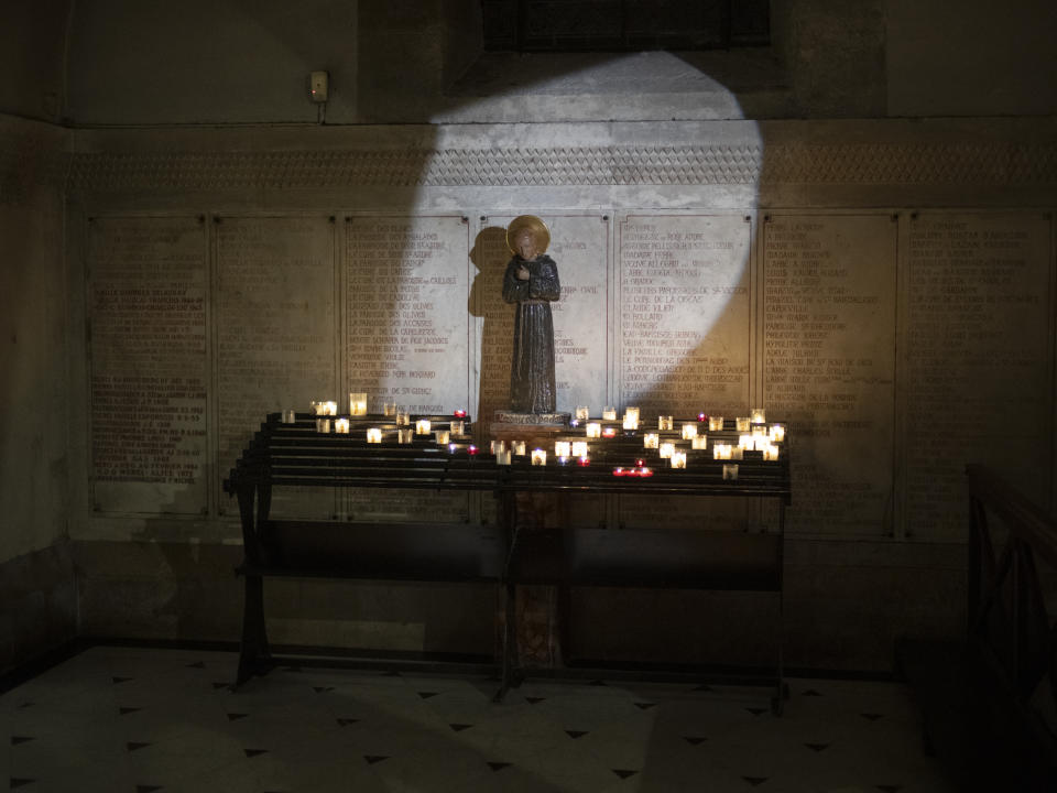 Light shines on an icon at the Notre Dame de la Garde Basilica in Marseille, southern France, Friday, April 19, 2024. (AP Photo/Daniel Cole)