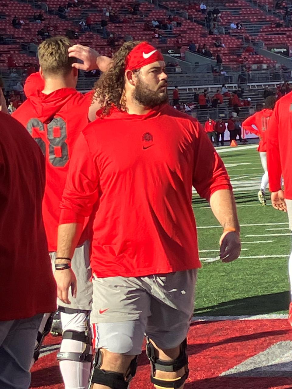 Quinton Burke takes part in pregame warmups before Ohio State's final regular season game at the Shoe against Minnesota on Saturday, Nov. 18.