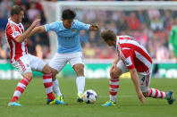 Stoke City's Erik Pieters (left) and Robert Huth challenge Manchester City's Sergio Aguero (centre) during the Barclays Premier League match at the Britannia Stadium, Stoke On Trent.