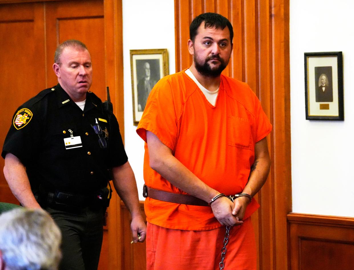 Jacob Bumpass, 35, is escorted into Clermont County Common Pleas Courtroom for a hearing, Wednesday, August 23, 2023. Bumpass was convicted in July of tampering with evidence and abuse of a corpse in the death of Paige Johnson, 17, who disappeared Sept. 23, 2010. Her body was discovered in March of 2020. Bumpass’s attorney, H. Louis Sirken, was asking for either an acquittal or a new trial. Judge Kevin T. Miles denied both. Sentencing is Sept. 7. 