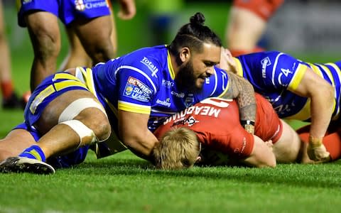 Halliwell Jones Stadium, Warrington, England; Betfred Super League rugby, Warrington Wolves versus London Broncos; Ben Murdoch-Masila of Warrington Wolves prevents James Meadows of London Broncos from playing the ball quickly - Credit: Action Plus