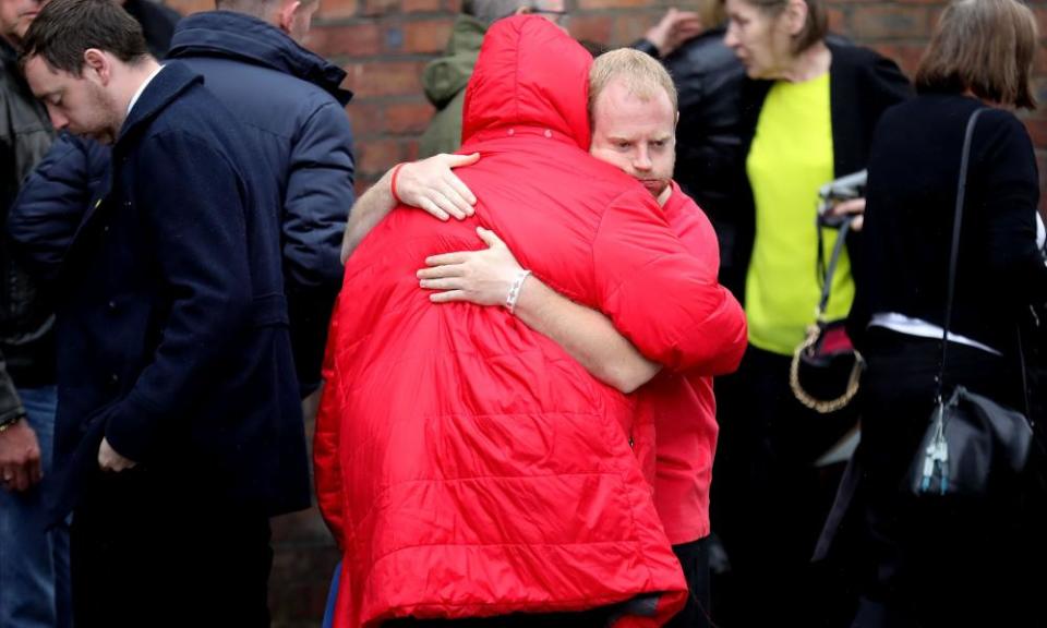 Family members react after the families of the 96 Hillsborough victims were told the decision that the Crown Prosecution Service will proceed with criminal charges.