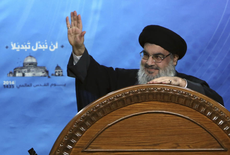 FILE -- In this July 25, 2014, file photo, Hezbollah leader Sayyed Hassan Nasrallah speaks during a rally to mark Jerusalem Day or Al-Quds day, in the southern suburb of Beirut, Lebanon. On Tuesday, March. 26, 2019, Nasrallah, in a televised speech, said the decision proves that "resistance" is the only way to retake lands occupied by Israel and that the "great Satan" (the United States) cannot sponsor the "so-called peace process." (AP Photo/Bilal Hussein, File)