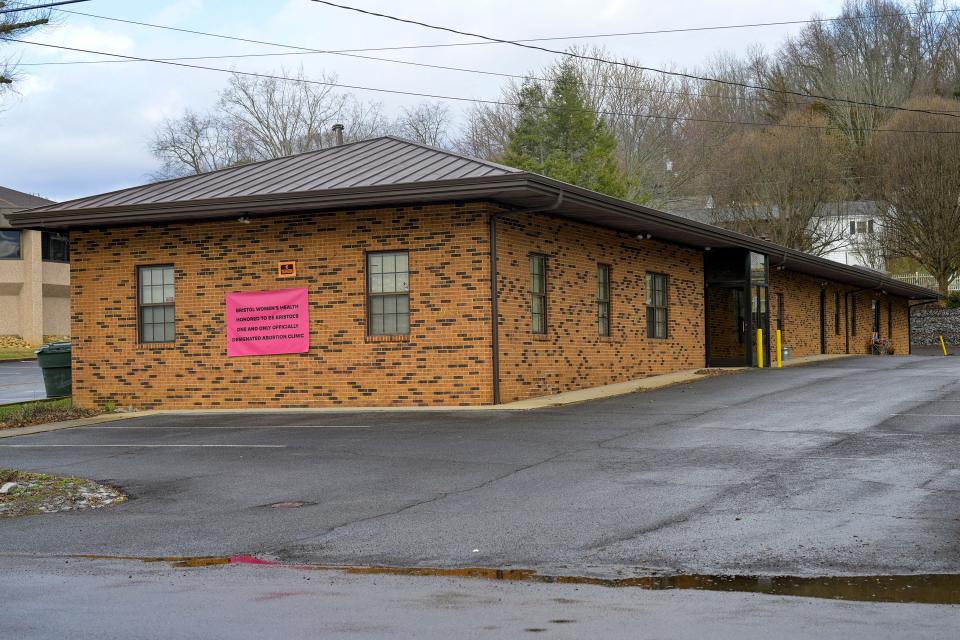 A temporary signs hangs on the outside of the Bristol Women's Health Clinic on Thursday, Feb. 23, 2023 in Bristol,Va., Residents in southwestern Virginia have battled for months over whether abortion clinics limited by strict laws in other states should be allowed to hop over the border and operate there. Similar scenarios are beginning to play out in communities along state lines around the country since the U.S. Supreme Court overturned Roe v. Wade.