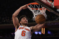 New York Knicks guard Quentin Grimes dunks against the Houston Rockets during the second half of an NBA basketball game Monday, March 27, 2023, in New York. (AP Photo/Adam Hunger)