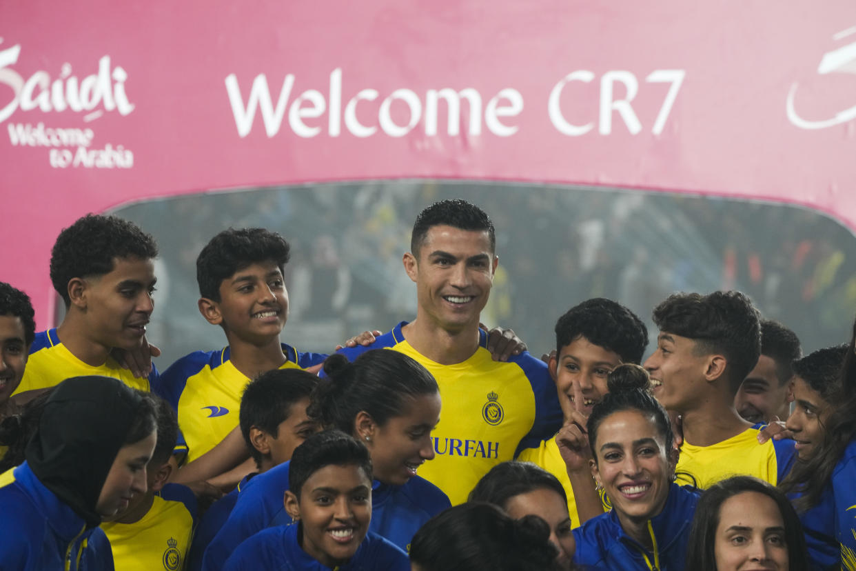 Cristiano Ronaldo smiles during his official unveiling as a new member of Al Nassr soccer club in in Riyadh, Saudi Arabia, Tuesday, Jan. 3, 2023.Ronaldo, who has won five Ballon d'Ors awards for the best soccer player in the world and five Champions League titles, will play outside of Europe for the first time in his storied career. (AP Photo/Amr Nabil)