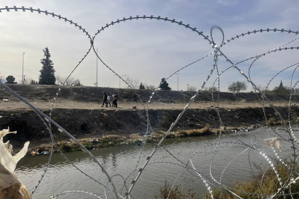 Razor wire is strung along the U.S.-Mexico border in El Paso, Texas, on Tuesday, Dec. 20, 2022. (AP Photo/Giovanna Dell'Orto)