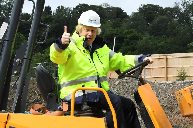 Britain's Prime Minister Boris Johnson gestures visits the Speller Metcalfe's building site in Dudley