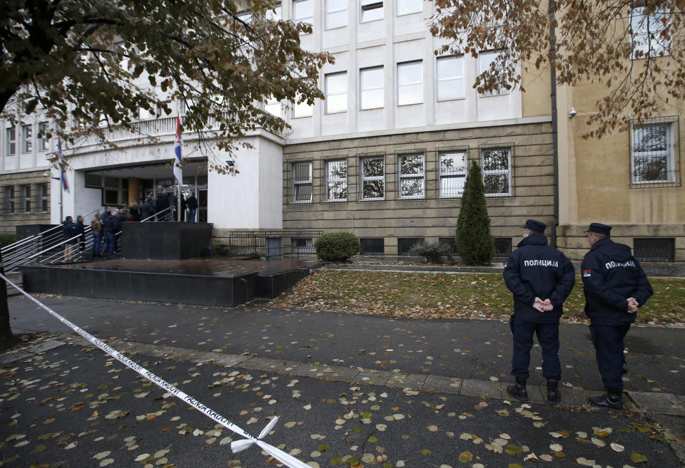 Serbian police officers guard The Organized Crime court during the sentencing of Darko Saric leader of a criminal organization, in Belgrade, Serbia, Monday, Dec. 10, 2018. A Serbian court has sentenced a Balkan drug lord to 15 years in prison for smuggling 5.7 tons of cocaine from South America to Europe. (AP Photo/Darko Vojinovic)