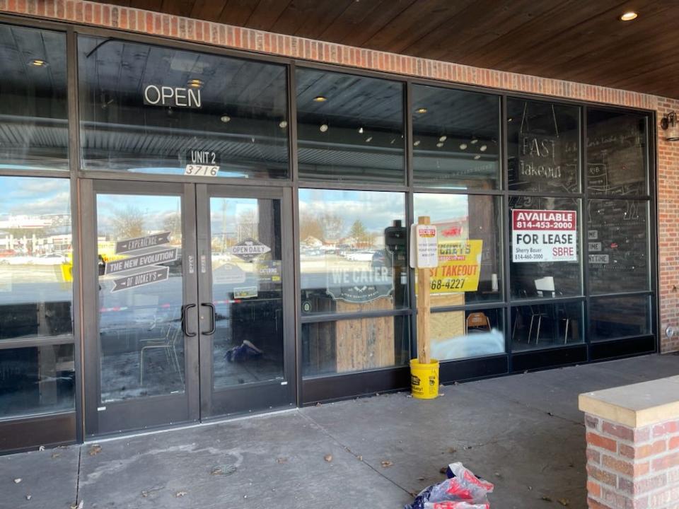 The front entrance area of the former Dickey's Barbecue Pit at 3716 Liberty St. displays a for-lease sign in the window.