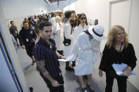 Models wait backstage prior to the Sacai mens Spring-Summer 2020 fashion collection presented in Paris, Saturday, June 22 2019. (AP Photo/Michel Euler)